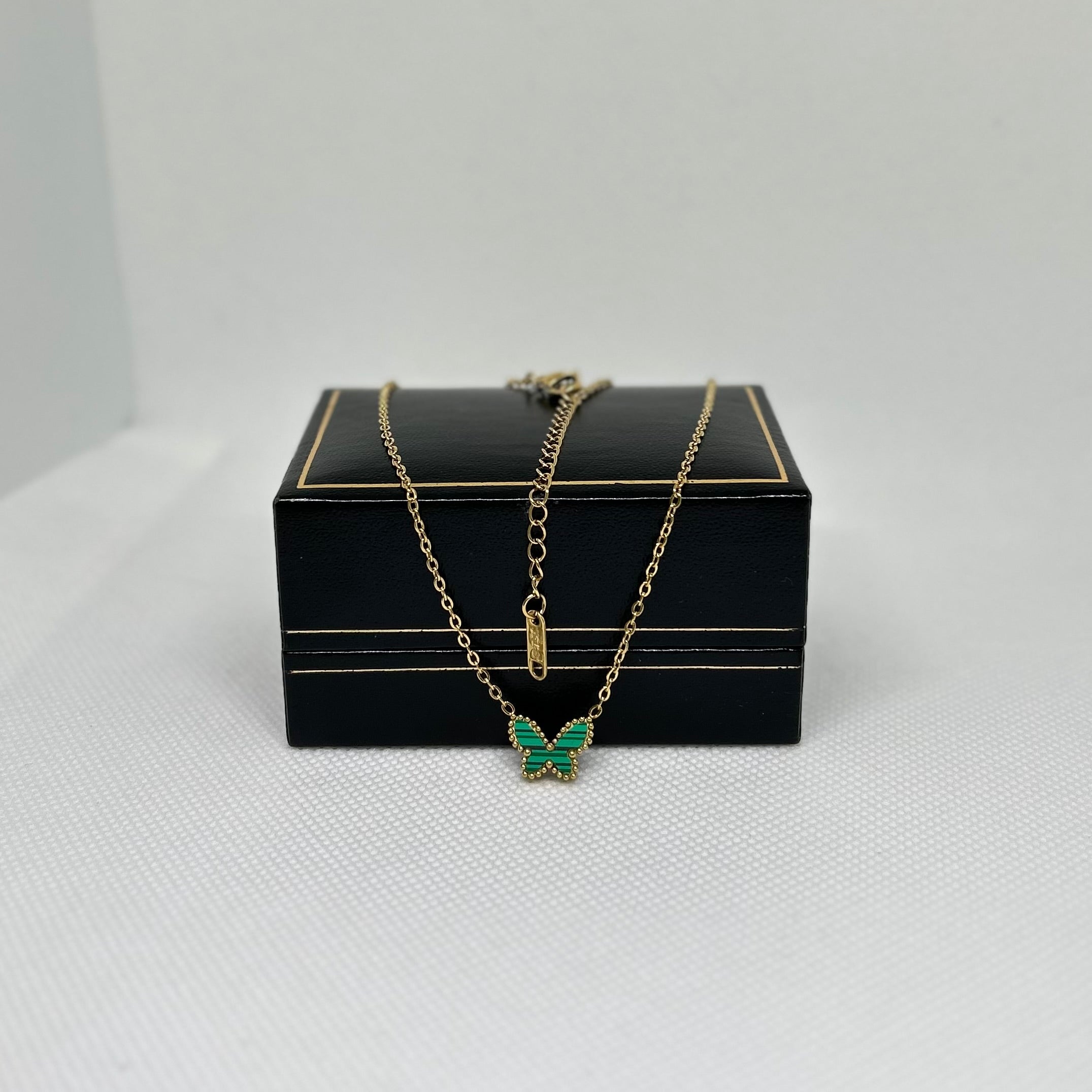 Necklace with a green butterfly pendant