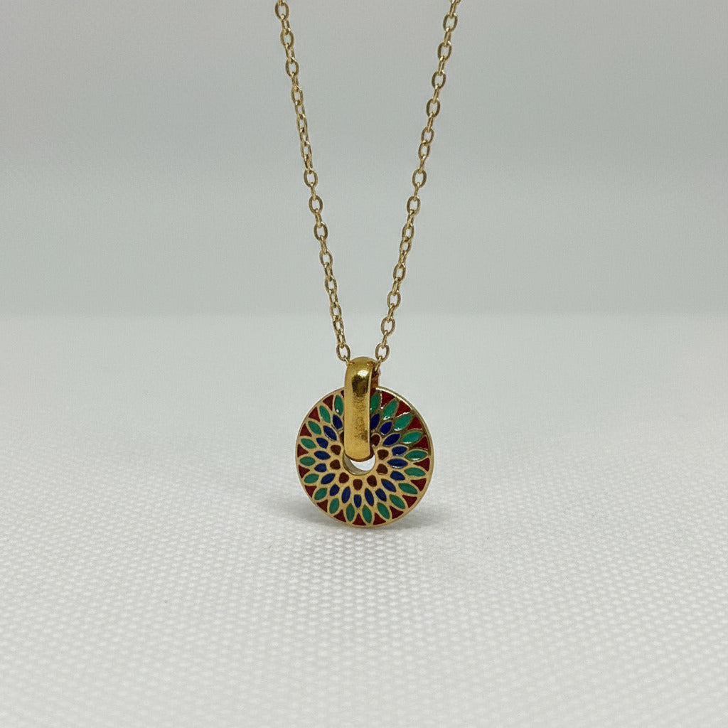 Gold necklace with a colorful circular pendant 
